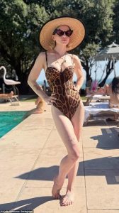 Kelly Osbourne, 41, shows off her curves in plunging leopard print swimsuit
