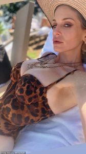 Kelly Osbourne, 41, shows off her curves in plunging leopard print swimsuit