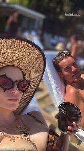 Kelly Osbourne, 41, shows off her curves in plunging leopard print swimsuit