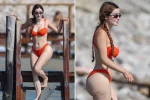 Demi Rose flaunts her famous curves in an orange bikini 23 Demi Rose flaunts her famous curves in an orange bikini