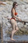 Demi Rose flaunts her famous curves in an orange bikini 26 Demi Rose flaunts her famous curves in an orange bikini