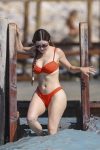 Demi Rose flaunts her famous curves in an orange bikini 25 Demi Rose flaunts her famous curves in an orange bikini