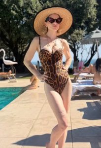 Kelly Osbourne, 41, shows off her curves in plunging leopard print swimsuit