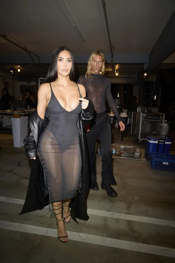 Kim Kardashian in a Sheer Black Dress and Leather Coat Leaves the UpDate Pop-Up on Melrose