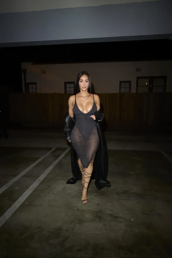 Kim Kardashian in a Sheer Black Dress and Leather Coat Leaves the UpDate Pop-Up on Melrose