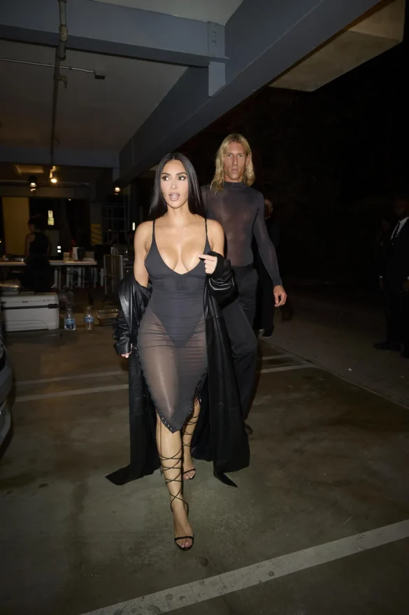 Kim Kardashian in a Sheer Black Dress and Leather Coat Leaves the UpDate Pop-Up on Melrose