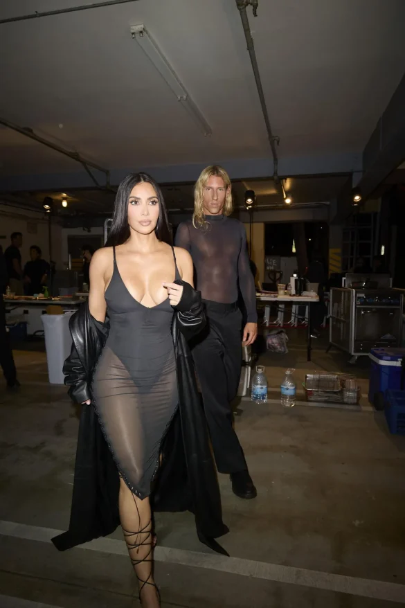 Kim Kardashian in a Sheer Black Dress and Leather Coat Leaves the UpDate Pop-Up on Melrose
