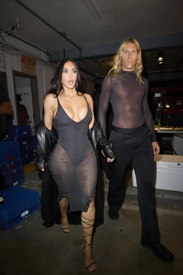 Kim Kardashian in a Sheer Black Dress and Leather Coat Leaves the UpDate Pop-Up on Melrose