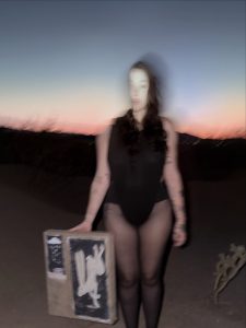 Noah Cyrus Goes Braless in a Daring Thong Bodysuit and Sheer Tights for a Desert Photo Shoot