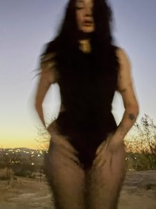 Noah Cyrus Goes Braless in a Daring Thong Bodysuit and Sheer Tights for a Desert Photo Shoot