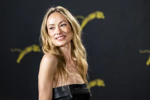 Olivia Wilde Wears a Strapless Peplum Top at The Invite Photocall