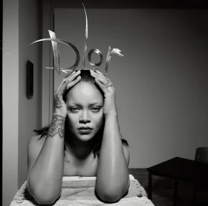 Rihanna US Elle Editorial Swings from Shaggy Orange Volume to Severe Black Draping
