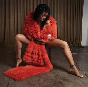 Rihanna US Elle Editorial Swings from Shaggy Orange Volume to Severe Black Draping